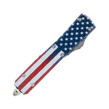 Closed automatic OTF knife featuring an American flag pattern with the tanto blade concealed inside the handle.