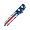 Closed automatic OTF knife featuring an American flag pattern with the tanto blade concealed inside the handle.