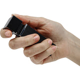 Black lipstick‑style personal alarm with a sleek cylindrical body and discreet push‑button activation.