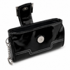 Black purse‑style wallet holster shown open with the attached keychain visible, displaying the interior compartments and soft lining.