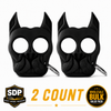 Two black Brutus self‑defense keychains shaped like stylized dog heads with pointed ear impact tips, shown together as a 2‑pack.