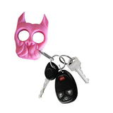 pink brutus self‑defense keychain attached to a set of keys, showing size and everyday‑carry use