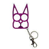purple color cat‑shaped metal self‑defense keychain displayed with cutout eye holes and pointed ear design