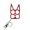 red cat‑shaped metal self‑defense keychain displayed with cutout eye holes and pointed ear design