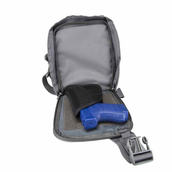 CCW satchel with hidden concealed carry compartment and ambidextrous holster.
