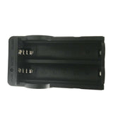 Close‑up view of a dual‑slot charger holding two 18650 lithium‑ion batteries, showing the contact rails and charging bays.