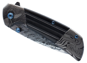 Titanium and Damascus folding knife shown closed with visible handle finish
