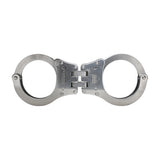 Backside view of hinged stainless steel NIJ‑certified handcuffs showing the hinge assembly and rear plate details.