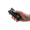 Jolt 3‑N‑1 Safe Keeper stun gun shown held in a person’s hand, highlighting its compact body, bright flashlight head, and front electrode prongs.