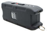 Jolt Jack stun gun shown with black buttons and a visible charge port on the side of the device.