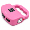 Pink JOLT Protector stun gun shown with its front LED flashlight illuminated, highlighting the compact body and squeeze‑to‑stun design.