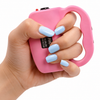 Pink JOLT Protector stun gun held in a hand, showing the ergonomic grip, squeeze‑to‑stun activation area, and front contact points.