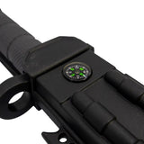 “Fire starter, sharpening rod, and compass displayed alongside the survival knife.”