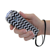 Ladies Choice stun gun shown with a bold chevron pattern across the body in a compact, curved design.