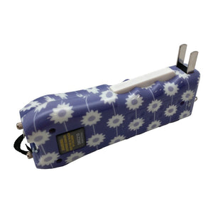 Ladies Choice Daisy stun gun shown with its built‑in charge plug extended from the base of the device.