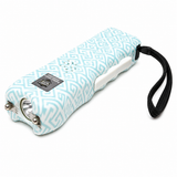 Teal Ladies Choice stun gun displayed upright with its safety switch and activation button visible.