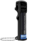 Side angle highlighting the hinged black flip‑top safety cover on the Mace 3‑in‑1 Police stream pepper spray.