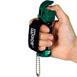 Close‑up of the Mace Muzzle dog repellent spray showing the safety lever positioned on top of the canister.