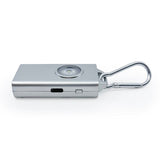 Silver Micro Guard keychain alarm displaying its alert button and function controls on the front panel