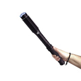 Mini Barbarian stun gun baton displayed in someone’s hand, highlighting its ergonomic handle and sturdy build.