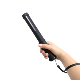 compact Streetwise stun baton featuring grab‑guard strips shown in hand being held