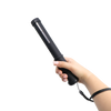 compact Streetwise stun baton featuring grab‑guard strips shown in hand being held