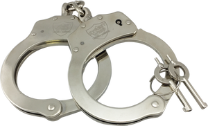Nickel‑plated steel handcuffs shown fully extended with two included keys positioned beside the locking mechanism.