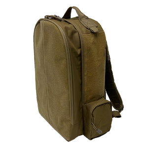 Side view of a tan tactical patch backpack featuring large hook‑and‑loop panels and a streamlined profile.