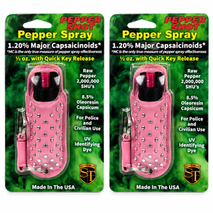 Two Pepper Shot 1.2% MC pepper sprays with pink Halo rhinestone leatherette holsters and quick-release keychains.