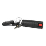 Black hard‑case pepper spray shown with attached keychain loop and keys.