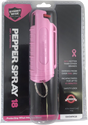 Pink pepper spray keychain displayed in retail packaging with clear blister front and printed safety information.