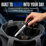 Permanent‑marker‑style self‑defense pen shown as part of an everyday‑carry setup, blending in with common items.
