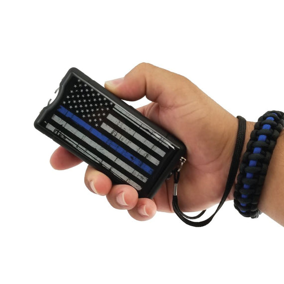 Streetwise Blue Line 9 Million Volt rechargeable stun gun featuring the Thin Blue Line American flag design, LED flashlight, metal disable pin, and heavy-duty construction.