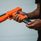 Load‑ready view of Sabre inert 0.68‑cal projectiles and CO2 cartridges, with all 14 pieces organized to demonstrate correct placement.