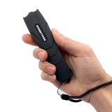 Black Serpent stun gun shown held in a person’s hand, highlighting its curved ergonomic body and front electrode area.