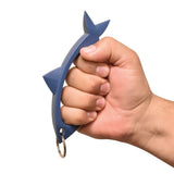 Shar‑Key blue self‑defense keychain shown in hand to display size, grip, and ergonomic finger placement