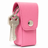 Pink Smack stun gun shown inside its fitted black holster, highlighting the secure pouch and flap closure.