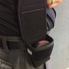 Sting Ring stun gun carried in its holster while worn, highlighting the compact size and secure attachment point.