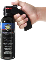 Streetwise 18 fogger pepper spray (16‑oz) with pistol‑grip handle shown in hand to display size, grip, and control.