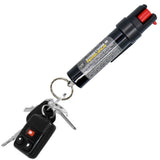 Compact 0.75‑oz Streetwise 18 stream pepper spray clipped to a set of keys, displaying the key ring and carry clip.