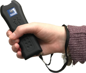Streetwise Black Jack stun gun shown held in a person’s hand, highlighting its compact size and rubberized grip.