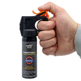 Streetwise 3‑ounce fogger pepper spray with Fire‑Master nozzle shown in hand to display size, grip, and actuator placement.