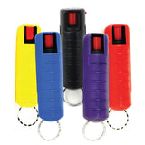 assorted color Streetwise 18 pepper spray keychains arranged in rows