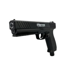 Side view of the Streetwise Heat Pepper Launcher California‑compliant model showing its compact body, trigger, and safety markings.