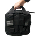 Closed black zippered carry bag for the Streetwise Heat pepper launcher shown with its compact rectangular shape and stitched handle.