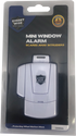 Retail packaging for the Streetwise Mini Window Alarm showing the device image, branding, and listed features on the front of the carded blister pack.