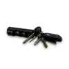 sticky gel pepper spray detail with safety mechanism visible and keys attached to the keyring