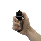 streetwise Sticky Gel 2‑ounce pepper spray shown in a person’s hand to display size, grip, and nozzle orientation