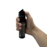 in‑use demonstration of the Streetwise 4‑ounce Sticky Gel pepper spray with gel stream emitted from the actuator