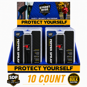 Streetwise black stream‑pattern pepper spray countertop display containing ten canisters arranged upright with branding on the front panel.